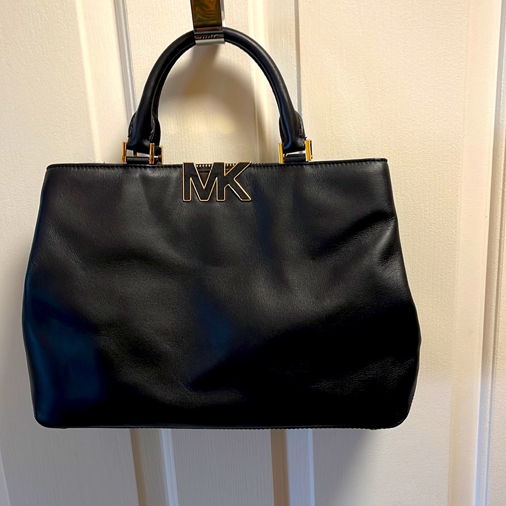 Authentic Michael Michael Kors, black and gold, soft, leather handbag.
